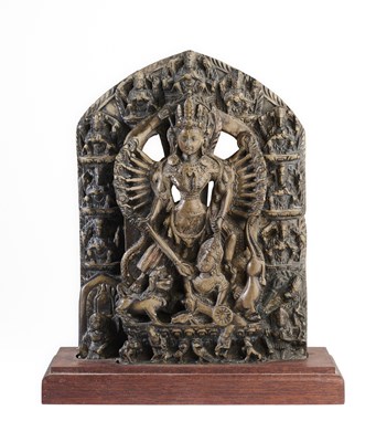 Lot 150 - A GREENISH GREY STONE RELIEF DEPICTING DURGA MAHISASURAMARDINI, NEPAL, 18TH/19TH CENTURY