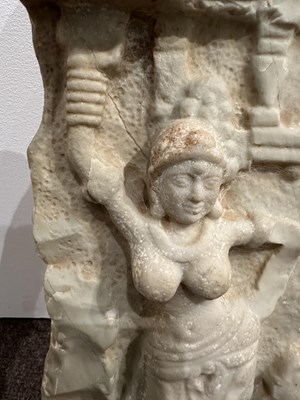 Lot 159 - A LIMESTONE FRAGMENT PROBABLY DEPICTING THE BIRTH OF BUDDHA, EASTERN DECCAN, 1ST/2ND CENTURY A.D.