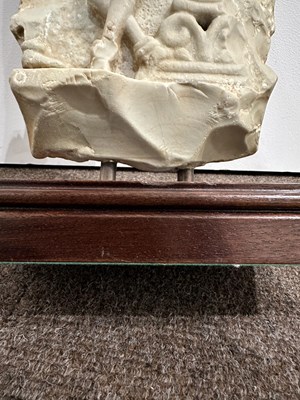 Lot 159 - A LIMESTONE FRAGMENT PROBABLY DEPICTING THE BIRTH OF BUDDHA, EASTERN DECCAN, 1ST/2ND CENTURY A.D.