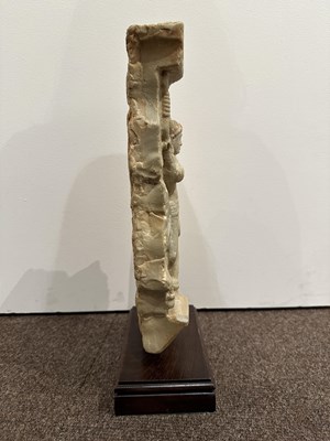 Lot 159 - A LIMESTONE FRAGMENT PROBABLY DEPICTING THE BIRTH OF BUDDHA, EASTERN DECCAN, 1ST/2ND CENTURY A.D.