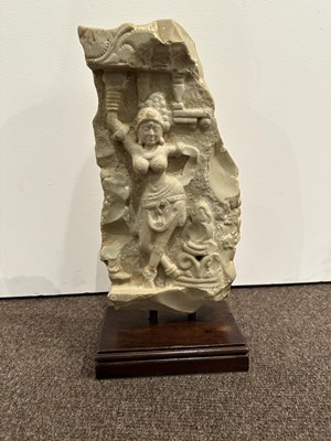 Lot 159 - A LIMESTONE FRAGMENT PROBABLY DEPICTING THE BIRTH OF BUDDHA, EASTERN DECCAN, 1ST/2ND CENTURY A.D.