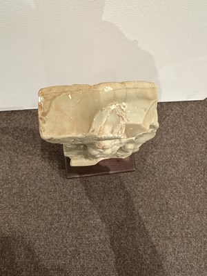 Lot 159 - A LIMESTONE FRAGMENT PROBABLY DEPICTING THE BIRTH OF BUDDHA, EASTERN DECCAN, 1ST/2ND CENTURY A.D.