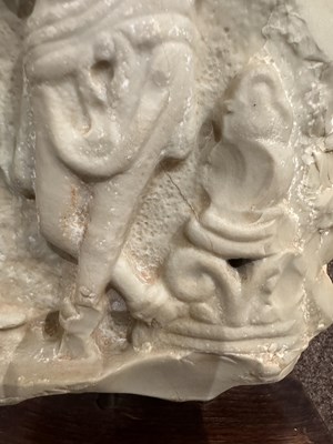Lot 159 - A LIMESTONE FRAGMENT PROBABLY DEPICTING THE BIRTH OF BUDDHA, EASTERN DECCAN, 1ST/2ND CENTURY A.D.