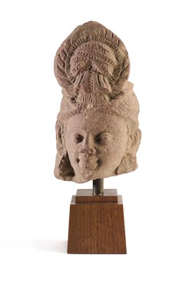 Lot 160 - A KUSHAN PINK SANDSTONE DOUBLE SIDED HEAD, MATHURA, NORTHERN INDIA, 2ND/3RD CENTURY A.D.