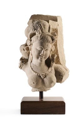 Lot 168 - A BUFF SANDSTONE FRAGMENTARY FEMALE BUST, CENTRAL INDIA, 10TH/11TH CENTURY