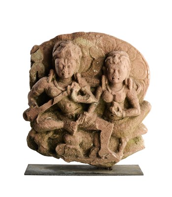 Lot 163 - A PINK SANDSTONE RELIEF FRAGMENT DEPICTING UMAMAHESVARA, CENTRAL INDIA, 8TH/9TH CENTURY