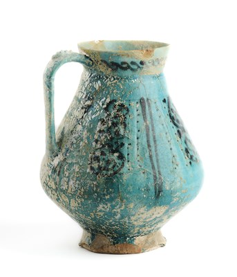 Lot 62 - A TURQUOISE GLAZED JUG, KASHAN OR GURGAN, CIRCA 12TH CENTURY