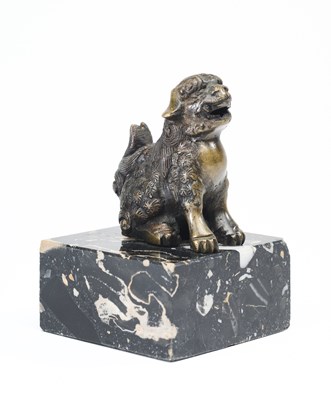 Lot 39 - A CHINESE BRONZE BUDDHISTIC LION, QING DYNASTY (1644-1911)