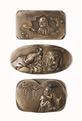 Lot 123 - THREE JAPANESE METALWORK TOBACCO POUCH PLAQUES, MEIJI PERIOD (1868-1912)