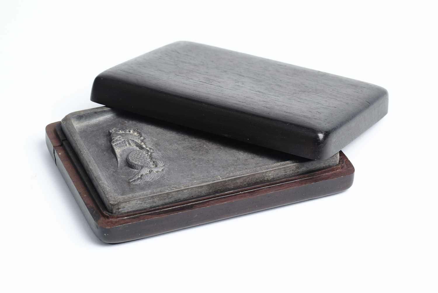 Lot 89 - A CHINESE CARVED INKSTONE, QING DYNASTY, 19TH CENTURY