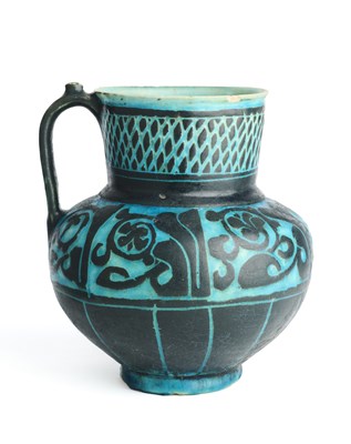 Lot 56 - A KASHAN TURQUOISE-GLAZED SILHOUETTE WARE JUG, PERSIA, 12TH/13TH CENTURY