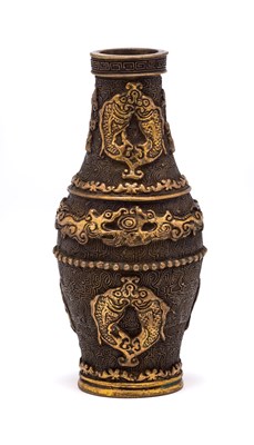 Lot 43 - A SMALL CHINESE PARCEL-GILT BRONZE BOTTLE...