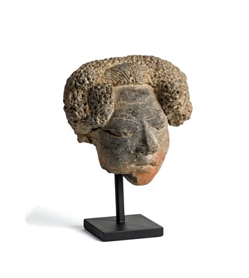 Lot 99 - A MAJAPAHIT TERRACOTTA HEAD OF A WOMAN^ JAVA^...