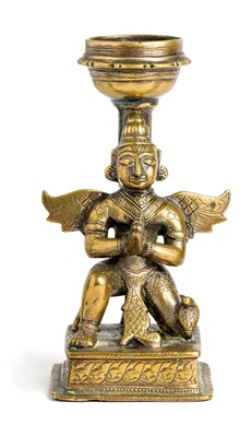 Lot 134 - A BRASS STAND IN THE FORM OF GARUDA^ INDIA^...