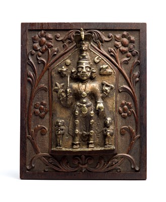 Lot 141 - A CAST BRASS VIRABHADRA PLAQUE^ WESTERN...