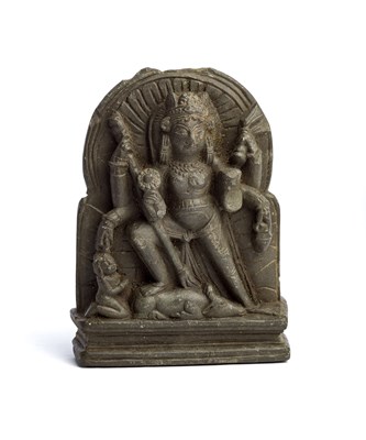 Lot 144 - A SMALL BLACK STONE PLAQUE DEPICTING DURGA...