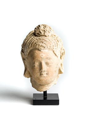 Lot 149 - A GANDHARA STUCCO FRAGMENTARY HEAD OF BUDDHA^...