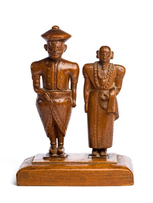 Lot 213 - A CARVED WOOD MODEL OF A KANDYAN ROYAL COUPLE^...