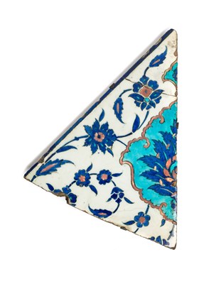 Lot 271 - A FRAGMENT FROM A LARGE IZNIK TILE^ OTTOMAN...