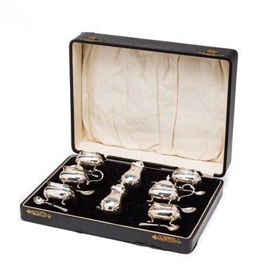 Lot 345 - A CASED GEORGE V SILVER EIGHT-PIECE CONDIMENT...