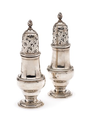 Lot 384 - A PAIR OF GEORGE III SILVER CASTERS^ JOHN...