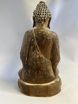 Lot 92 - A CHINESE SEATED LACQUERED WOOD BUDDHA, MING DYNASTY, 17TH CENTURY