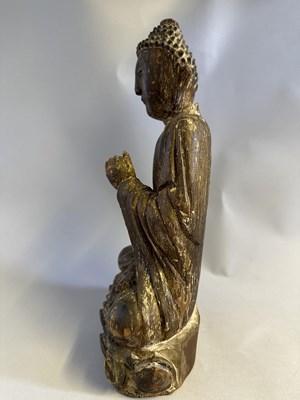 Lot 92 - A CHINESE SEATED LACQUERED WOOD BUDDHA, MING DYNASTY, 17TH CENTURY