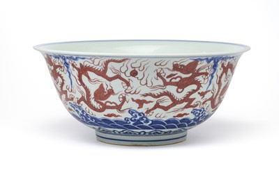 Lot 46 - A LARGE CHINESE MING-STYLE BLUE AND WHITE AND IRON-RED 'NINE DRAGON' BOWL