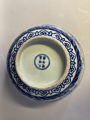 Lot 46 - A LARGE CHINESE MING-STYLE BLUE AND WHITE AND IRON-RED 'NINE DRAGON' BOWL