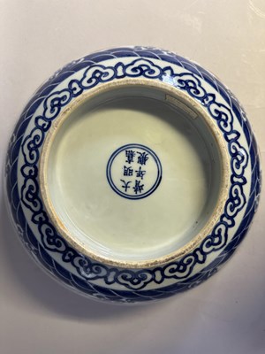 Lot 46 - A LARGE CHINESE MING-STYLE BLUE AND WHITE AND IRON-RED 'NINE DRAGON' BOWL