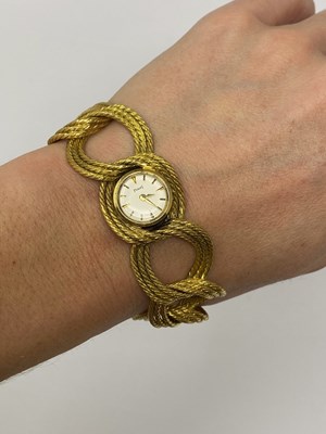 Lot 314 - PIAGET, REF.3115: A LADY'S GOLD BRACELET WATCH, SWISS, 1960s