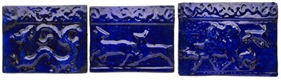 Lot 82 - THREE LARGE QAJAR MOULDED TILES, PERSIA, LATE 19TH CENTURY