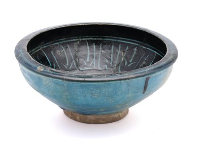 Lot 66 - A KASHAN BLACK PAINTED TURQUOISE BOWL, PERSIA, 13TH/14TH CENTURY