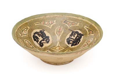 Lot 64 - A NISHAPUR SLIP PAINTED BOWL, PERSIA, CIRCA 10TH CENTURY