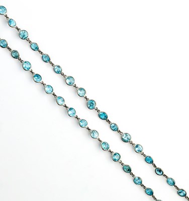 Lot 417 - BLUE ZIRCON LONG CHAIN, 1920s