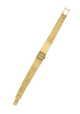 Lot 311 - JUVENIA: A LADY'S GOLD BRACELET WATCH, SWISS, CIRCA 1970