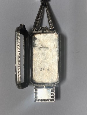 Lot 364 - AUDEMARS PIGUET & CO: ONYX AND DIAMOND LAPEL WATCH, 1920s