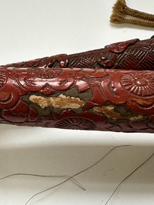 Lot 39 - TWO CHINESE CINNABAR LACQUER FLY WHISKS, QING DYNASTY, 19TH CENTURY