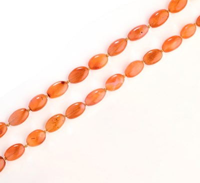 Lot 447 - CARNELIAN BEAD NECKLACE AND CORAL NECKLACE, 1900s