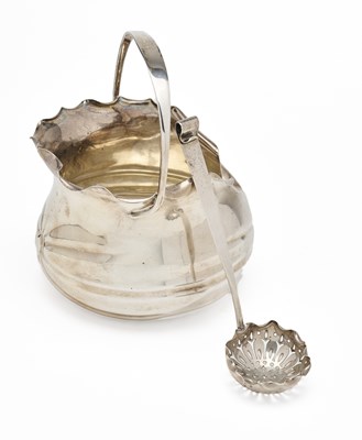 Lot 72 - CHRISTOPHER DRESSER (ATTRIBUTED): A VICTORIAN SILVER SUGAR BASKET AND SIFTER SPOON, HUKIN & HEATH OF BIRMINGHAM, LONDON, 1886