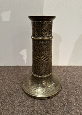 Lot 98 - A SAFAVID BRASS TORCH STAND, IRAN, 17TH CENTURY