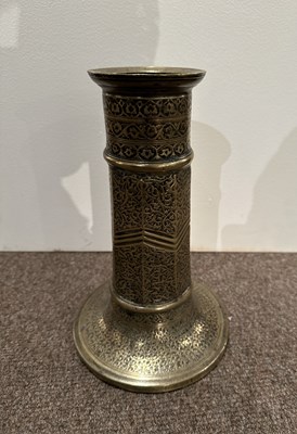 Lot 98 - A SAFAVID BRASS TORCH STAND, IRAN, 17TH CENTURY