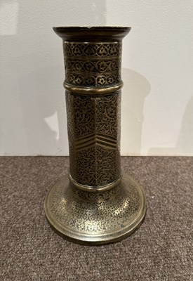 Lot 98 - A SAFAVID BRASS TORCH STAND, IRAN, 17TH CENTURY