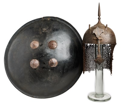 Lot 367 - AN INDO-PERSIAN KULAH KHUD AND LAQUERED HIDE SHIELD (DHAL), 19TH CENTURY