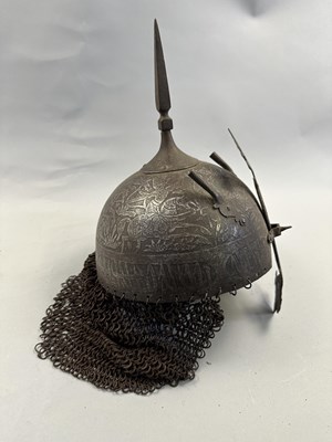 Lot 367 - AN INDO-PERSIAN KULAH KHUD AND LAQUERED HIDE SHIELD (DHAL), 19TH CENTURY