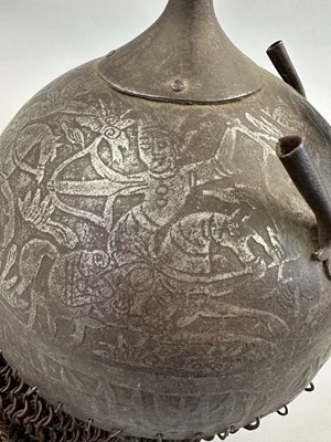 Lot 367 - AN INDO-PERSIAN KULAH KHUD AND LAQUERED HIDE SHIELD (DHAL), 19TH CENTURY