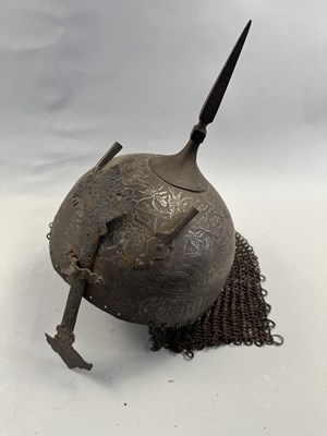 Lot 367 - AN INDO-PERSIAN KULAH KHUD AND LAQUERED HIDE SHIELD (DHAL), 19TH CENTURY