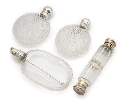 Lot 251 - A PAIR OF VICTORIAN SILVER-MOUNTED SCENT FLASKS AND ANOTHER TWO SILVER-MOUNTED SCENT FLASKS, ALL LONDON