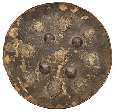 Lot 364 - AN ASIAN CIRCULAR HIDE SHIELD, 19TH CENTURY, POSSIBLY BHUTAN