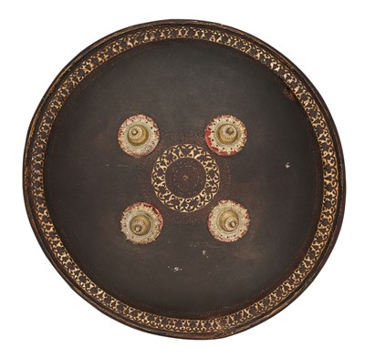 Lot 109 - AN INDIAN HIDE SHIELD (DHAL), 19TH CENTURY, SIGNED BHAGUAN KHOOSALOA, AHMEDABAD